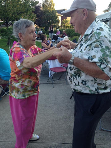 Ray and Marilyn Thompson dancing together at the long term care home. 