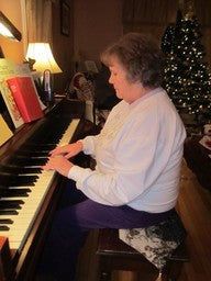 woman playing the piano
