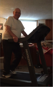 man on treadmill smiling