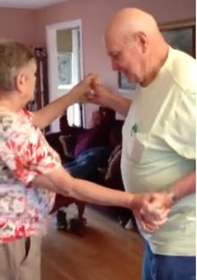 elderly couple dancing