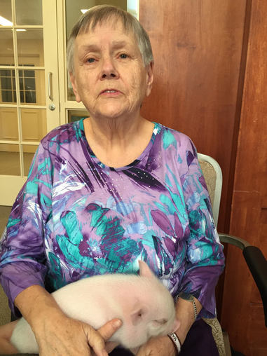 elderly woman with therapy animal