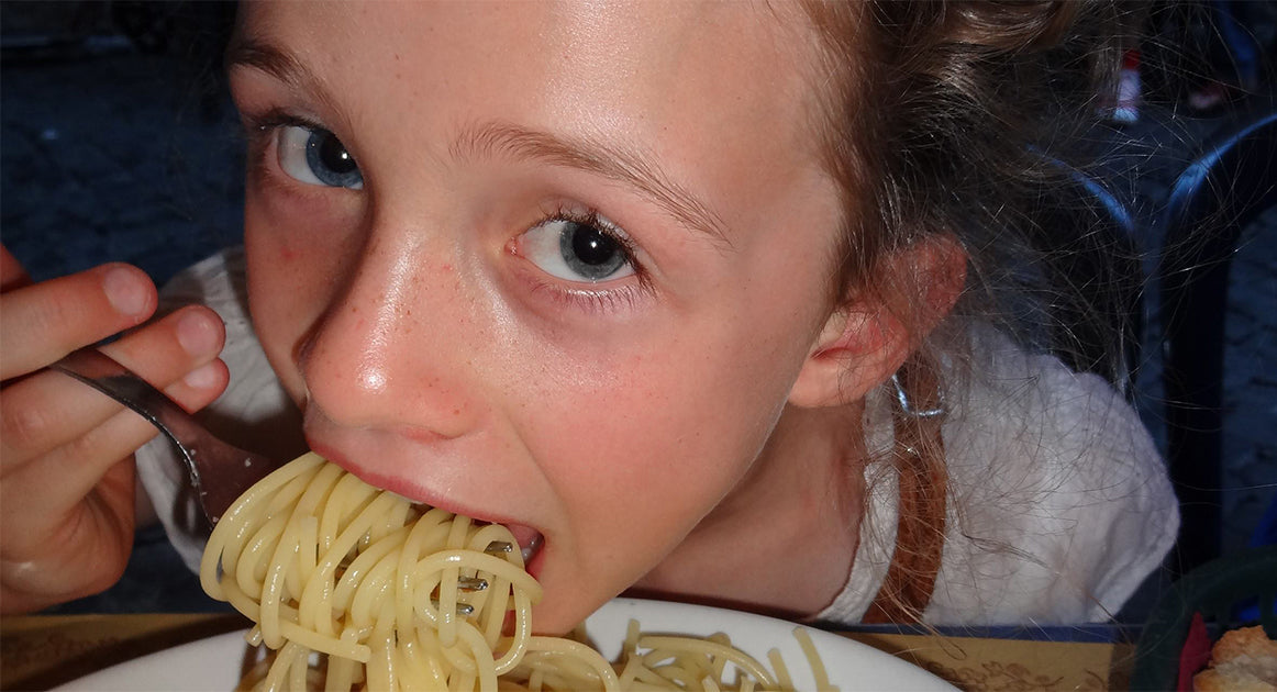 Judy's daughter eating spaghetti