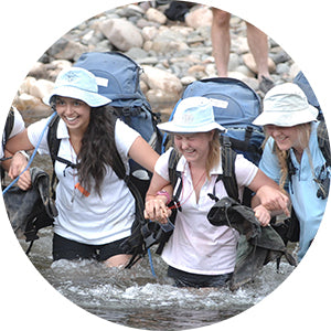 GGS students crossing a river