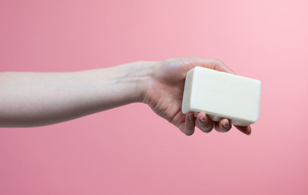 person holding a bar soap
