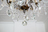 A Louis XV style Bronze and Crystal 8 Light Chandelier