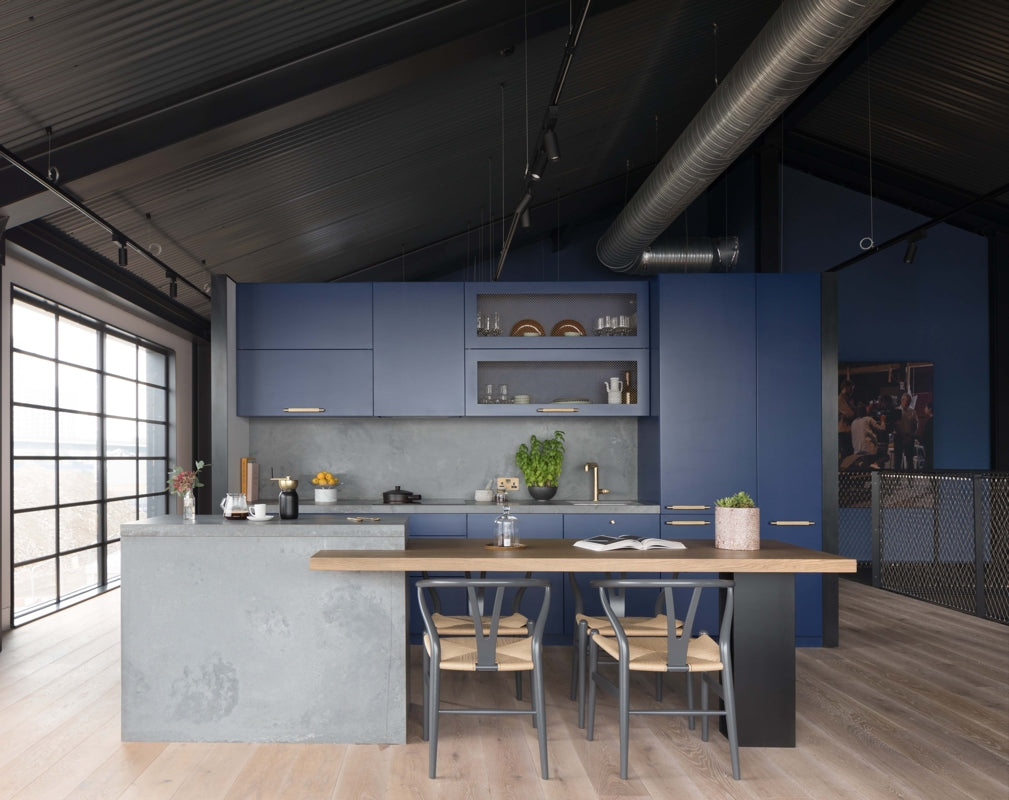 Caesarstone's 4033 Rugged Concrete quartz surfaces feature in the kitchen of an industrial home