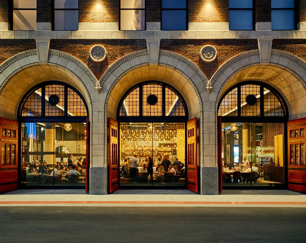 Guests of the Detroit Foundation Hotel enter the building through a massive arched, terracotta-faced portal, originally one of the fire engine doors.