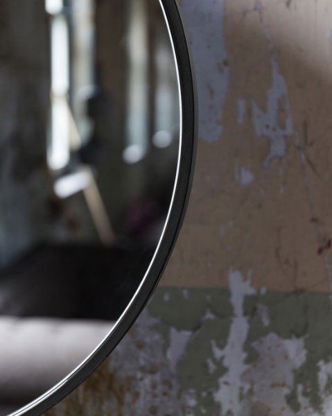 Dutchbone Attractif Industrial Style Mirror Close Up against a distressed wall