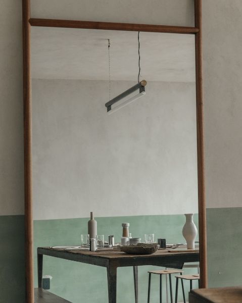 Frama Eiffel Pendant reflected in mirron in Frama Studio Apartment Mexico