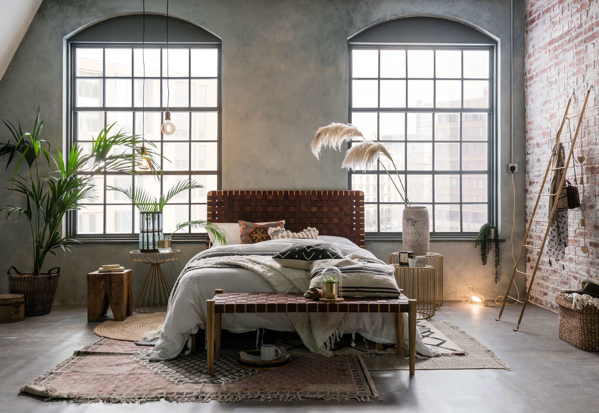 Industrial style bedroom featuring woven leather furniture and metallic furniture pieces from Cuckooland