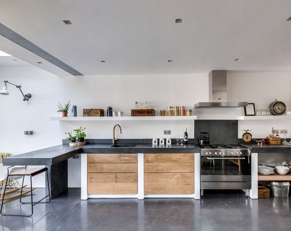 The open plan kitchen of this industrial style renovation by the Paper House Project 