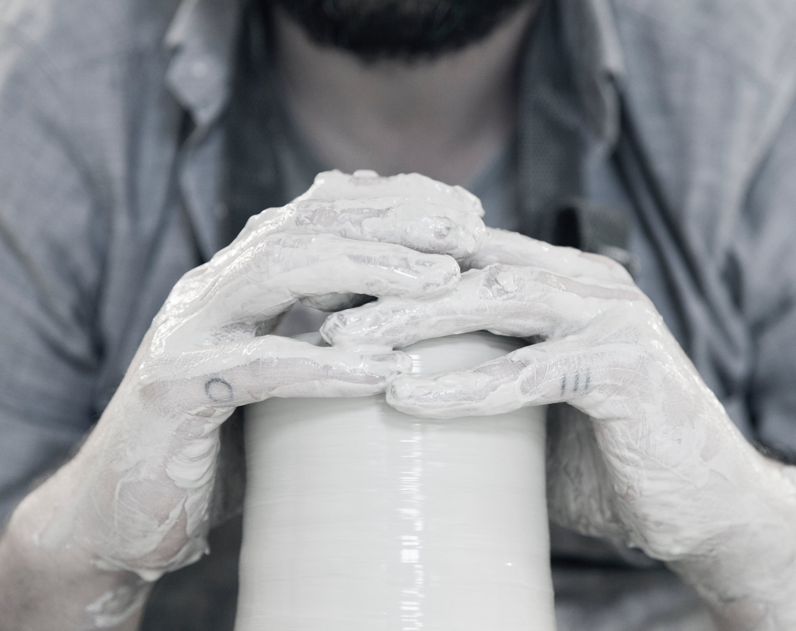 Process image of UK-based potter Jono Smart forming clay