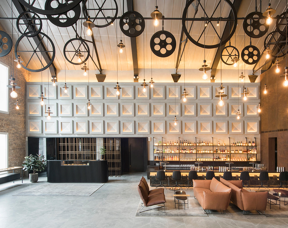 interior view of the warehouse hotel singapore features steampunk lighting installation