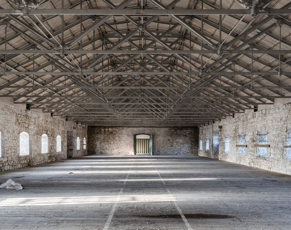 The Melville Building is situated in Royal William Yard, the Grade I listed ex-Naval victualling yard in Plymouth. It is undergoing redevelopment by Urban Splash and will offer 90,000 sq ft of office, retail and leisure space.