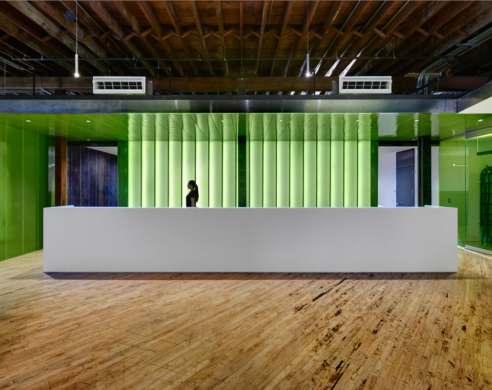 Warehouse-conversion-industrial-style-office-green-reception