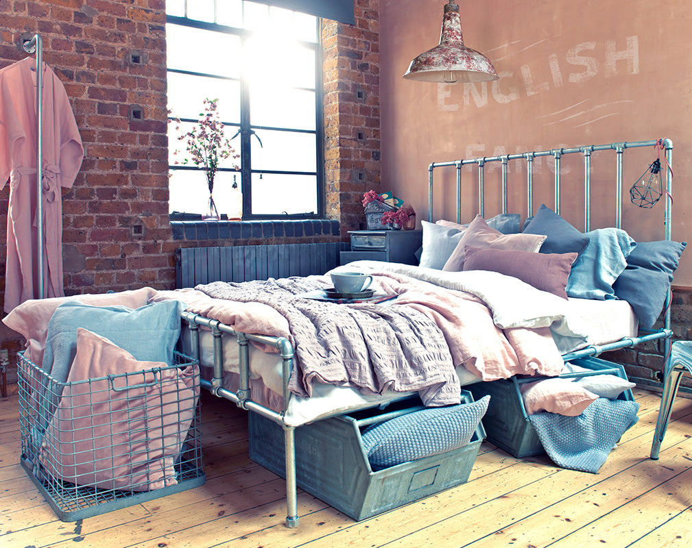 london warehouse conversion with pastel industrial bedroom scheme.