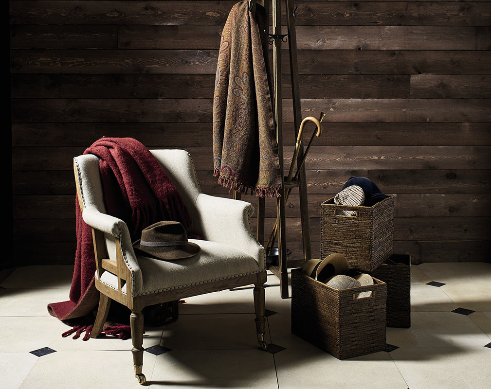 Trematon linen armchair with reclaimed timber background and vintage accessories