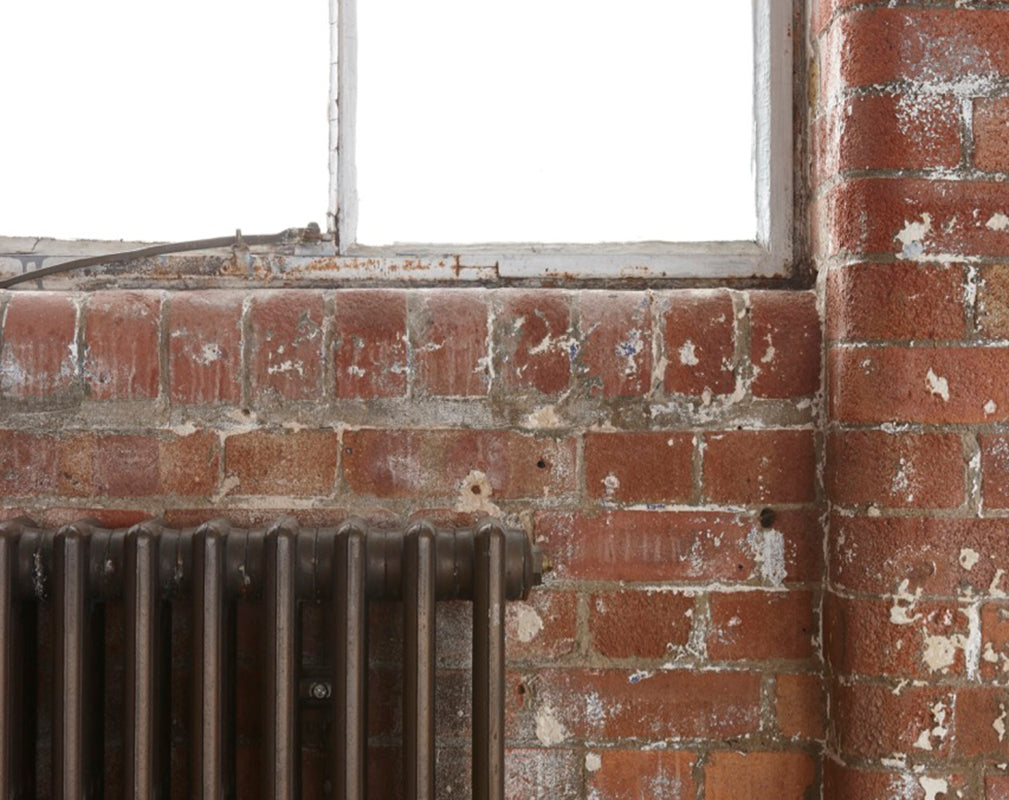 exposed brickwork and warehouse windows