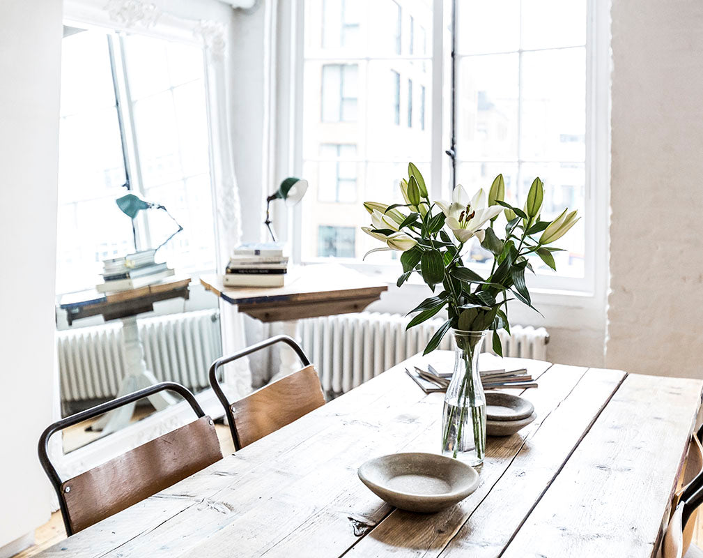 Dining table made from reclaimed timber scaffolding boards.