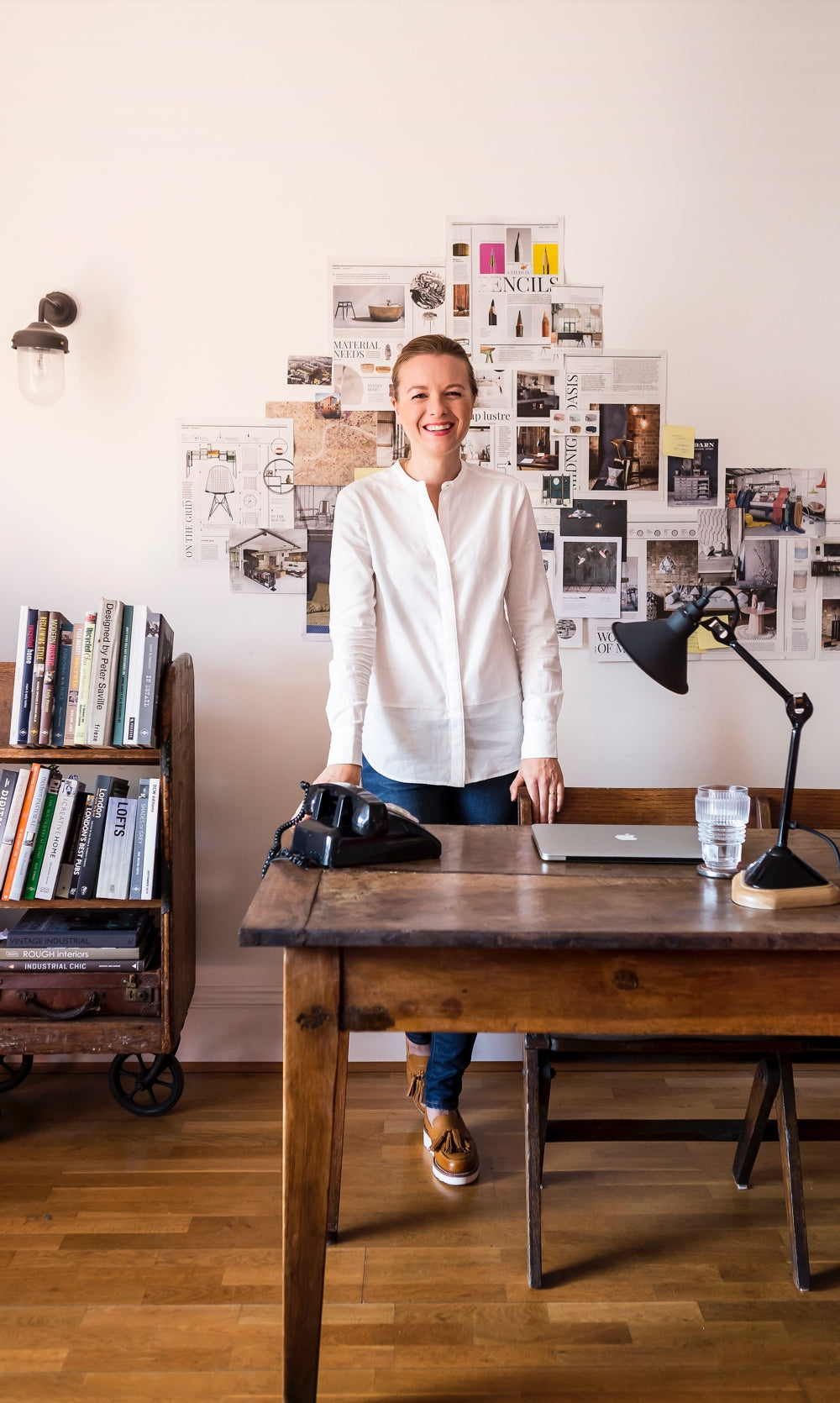 Warehouse Home founder Sophie Bush is photographed in her industrial chic dining room