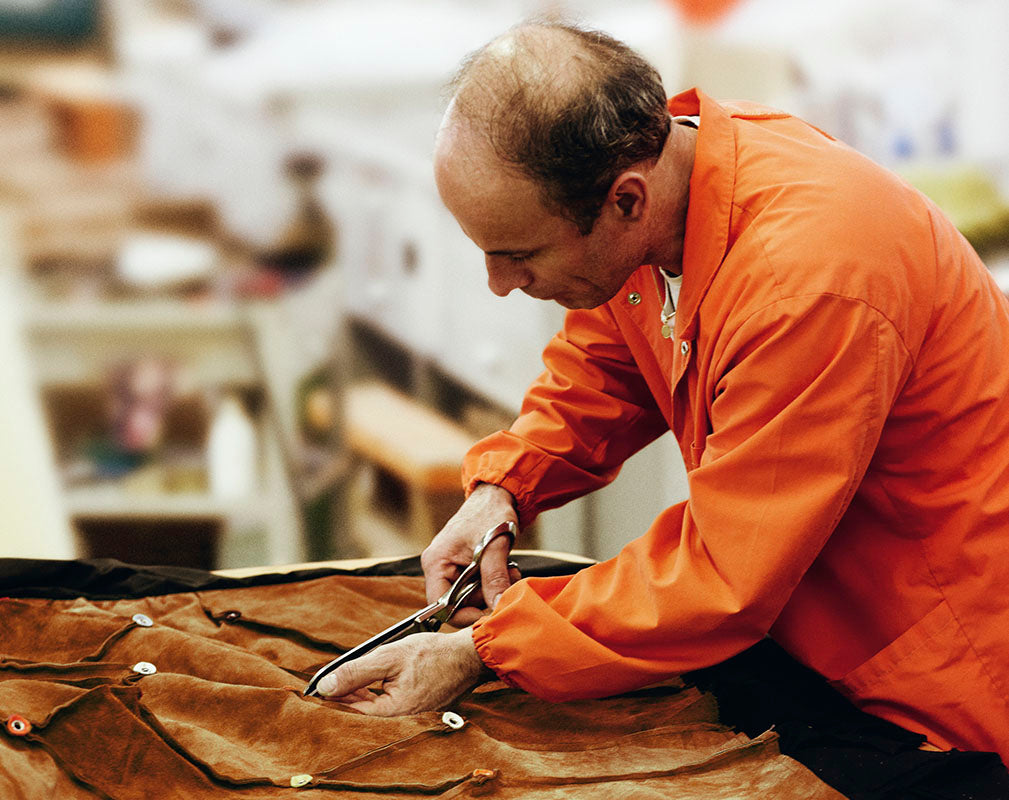 Suede congac leather cut by hand by expert craftsman at Poltrona Frau. 