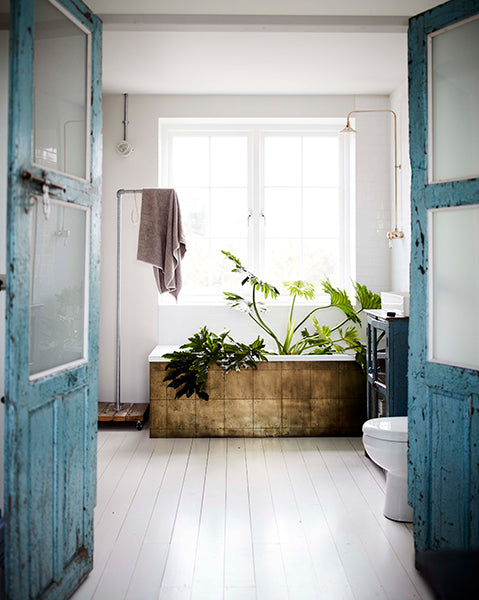 quirky interiors create brass tiles in bathroom for photographer debbie treloar