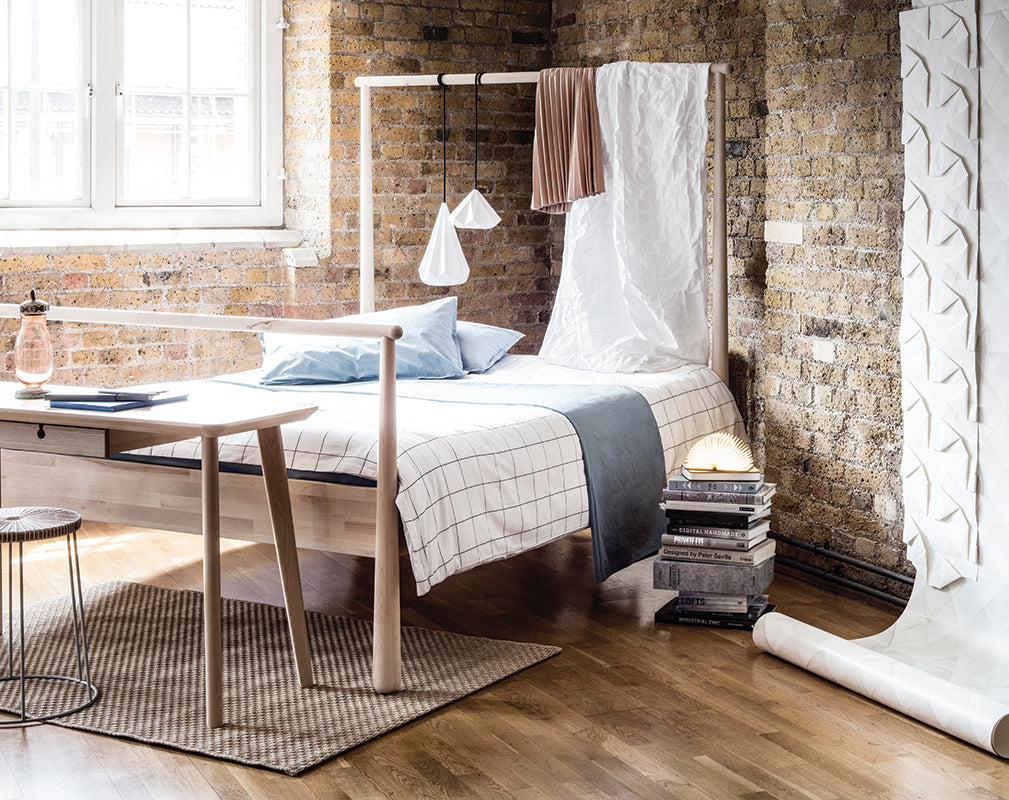 soft industrial bedroom within a london warehouse conversion