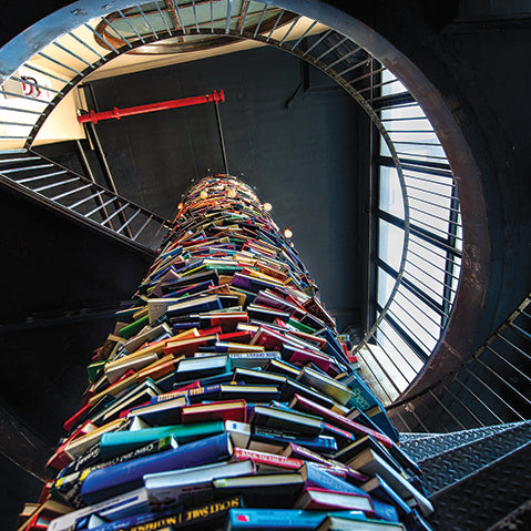 book-tower-set-within-a-steel-spiral-staircase-inside-the-paper-factory-hotel-in-williamsburg-new-york
