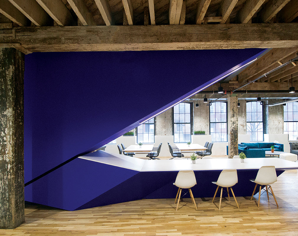 co working space in former industrial building with interior scheme inspired by origami