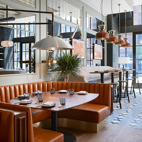 stylish pendant lights and a leather banquette feature in the proxi hotel chicago photography by david burke