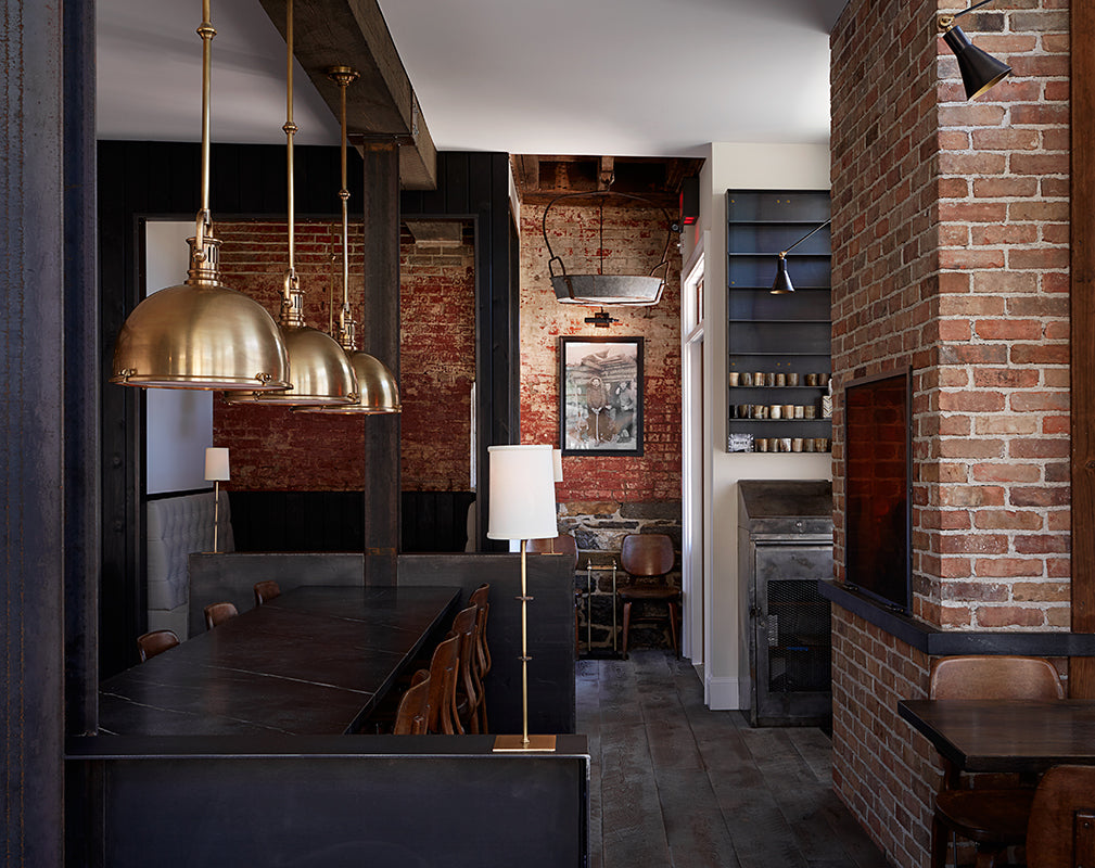 exposed brick walls and sturdy timber beams frame the restaurant of wm farmers and sons