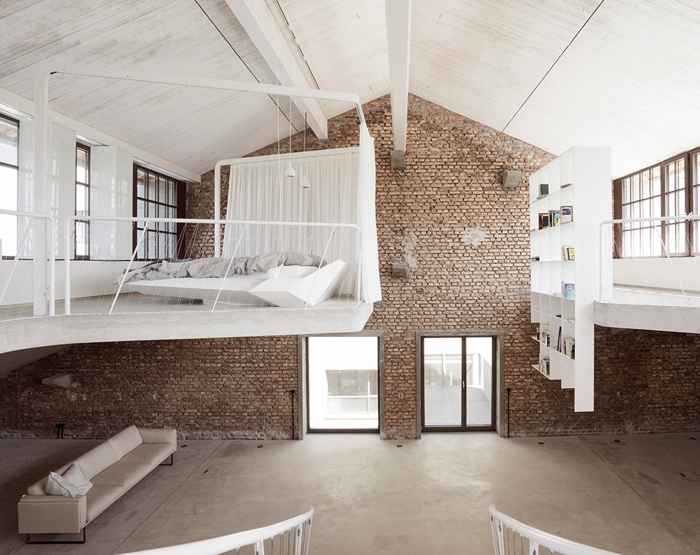 floating living room and bathroom features in this converted warehouse in salzburg austria