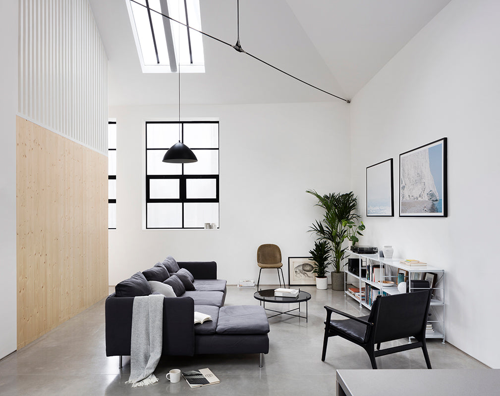 minimalist living room scheme in a converted london warehouse by paper house project