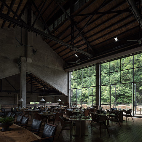 restaurant interior of alila yangshuo, china features concrete walls, steel columns and trusses photography by hao chen