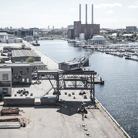 a converted industrial crane sits on copehagen's harbour
