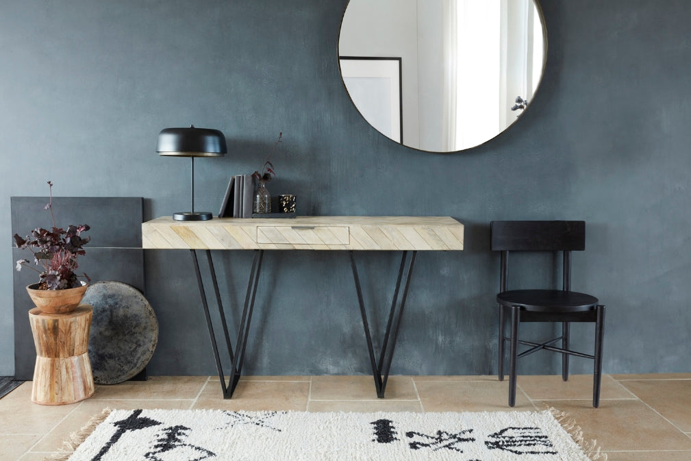 french connection table by french connection sits in modern rustic scene