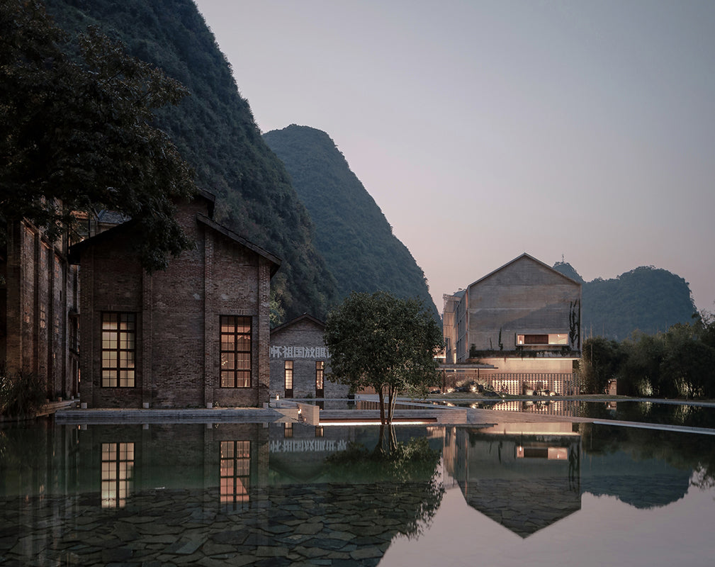 exterior of alila yangshuo a converted sugar factory sits along the yulong river, china photography by Shengliang  Su