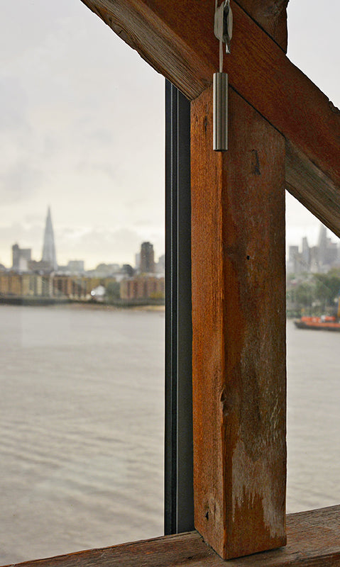 view of london's river thames from warehouse conversion apartment