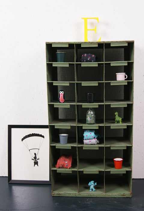 green industrial storage unit from blue ticking