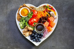 Healthy food inside of a heart-shaped tray
