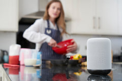woman talking to Google Home
