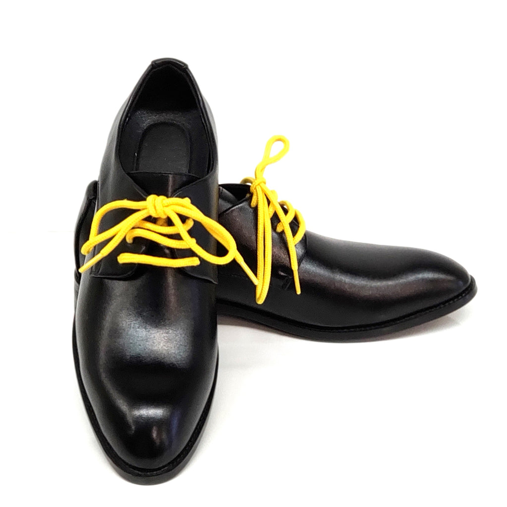 black shoes yellow laces