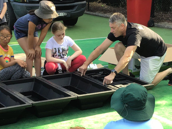 Vegepod staffer building a raised bed