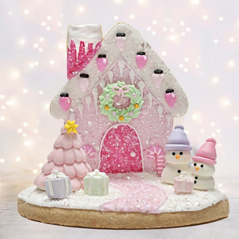 Pink Christmas Cookie Gingerbread House by Bakery Bling with Pink Edible Glitter Sugar Sprinkles and Pastel Baking for the Holidays Snowman Christmas Tree