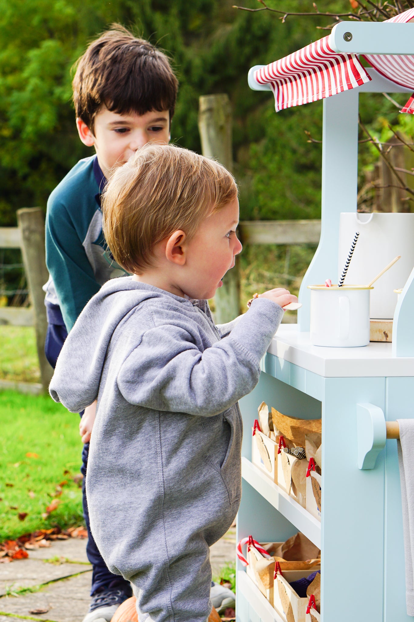 Set up a children's outdoor hot chocolate bar for hand warming role play fun