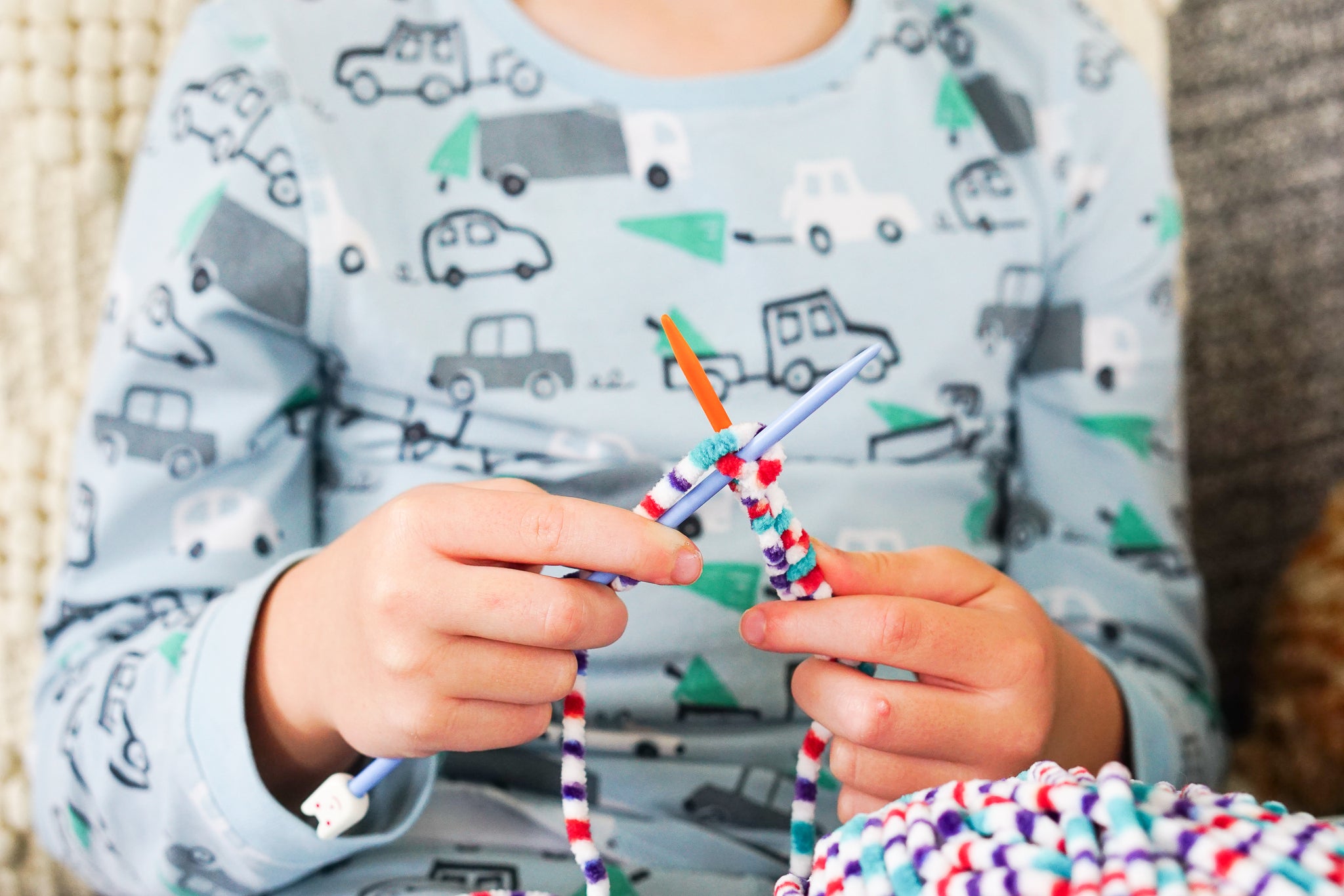 Knit a snuggly blanket for your child's doll's pram