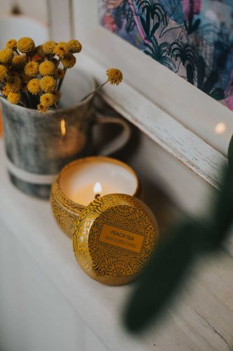 Soy candle on book shelf