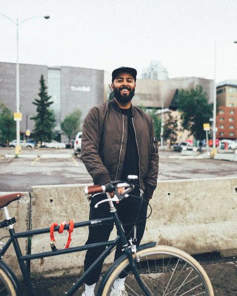 Alkarim Devani standing in front of Studio Bell in Calgary