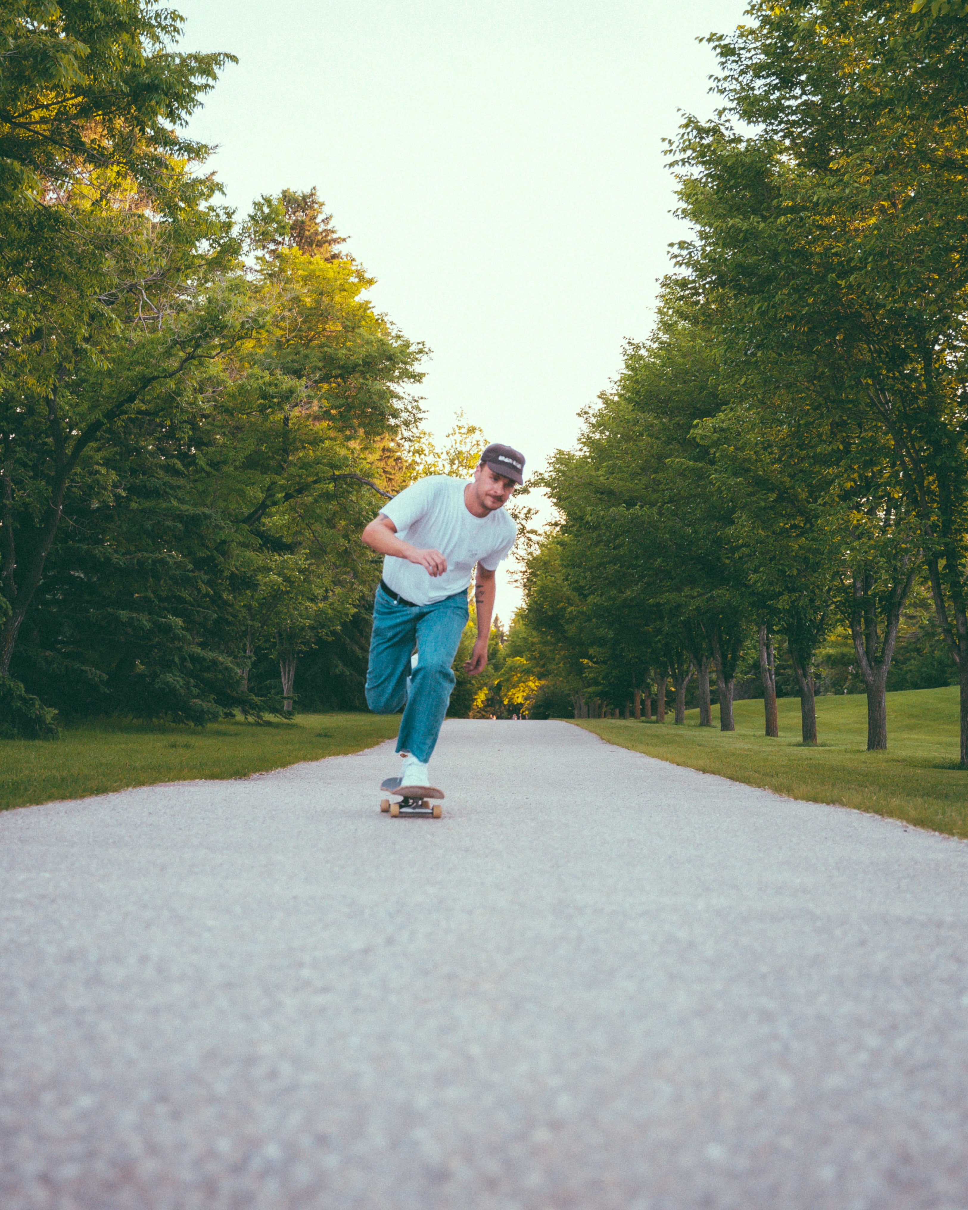 man pushing on skateboard