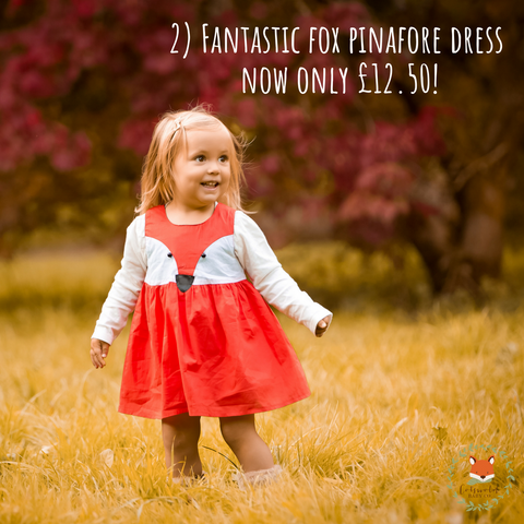 little girl wearing fox pinafore dress from cotswold baby co